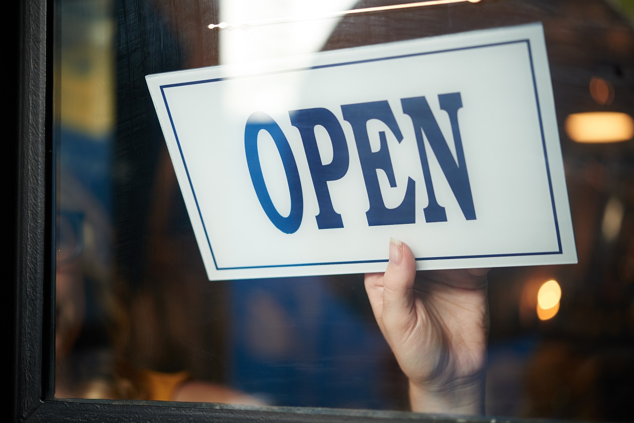 An open sign outside of a small business