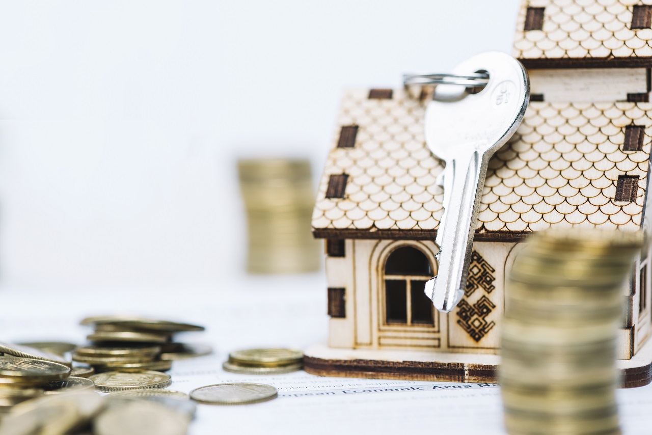 Miniature cardboard house representing collaterals