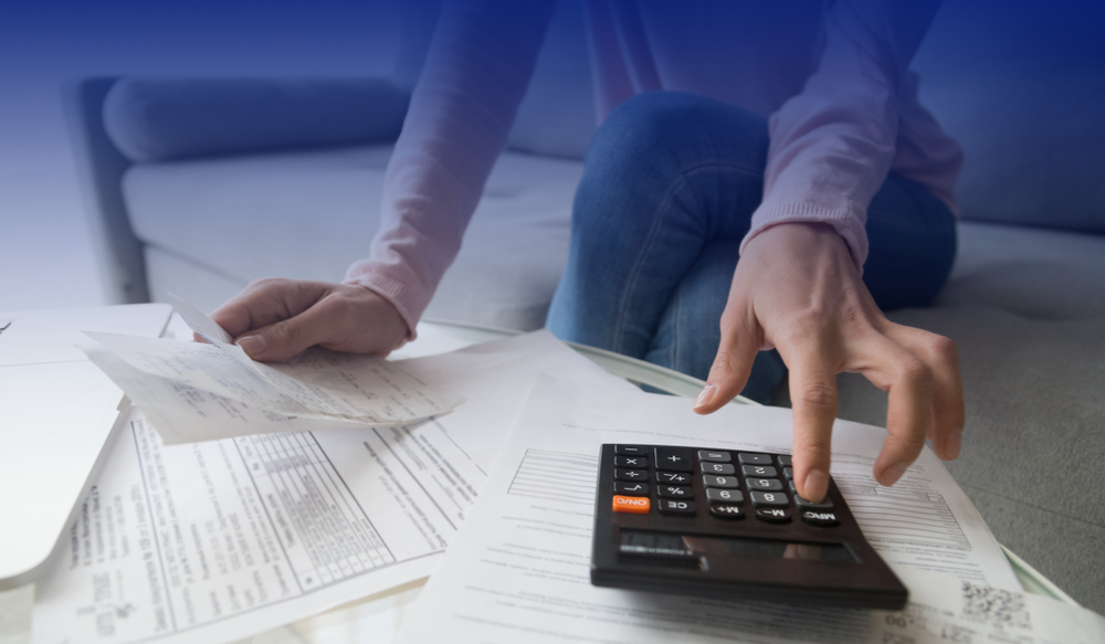 A woman calculating her expenses