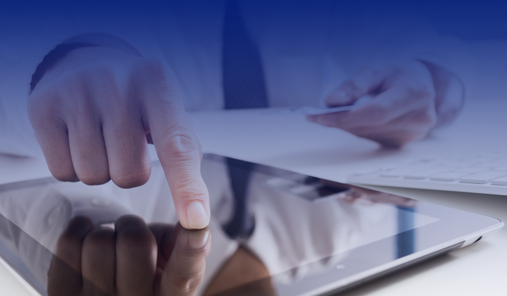 A man using his smart tablet