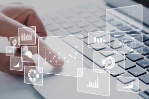 Business analytics illustrations and human hands working on laptop