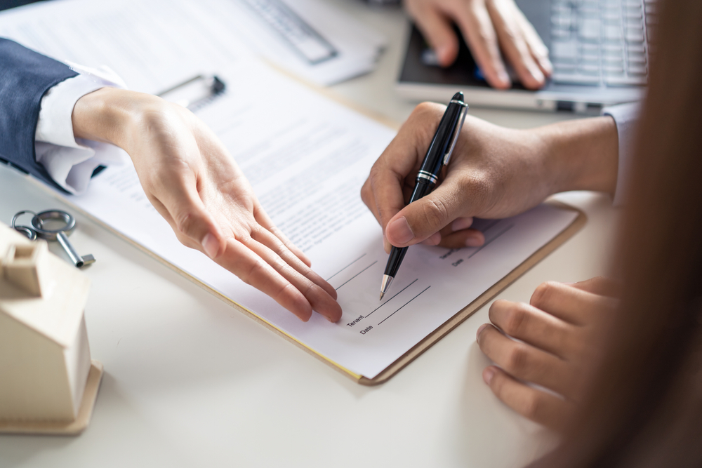 Closeup shot of a contract signing. This is related to the blog topic of loan terms.